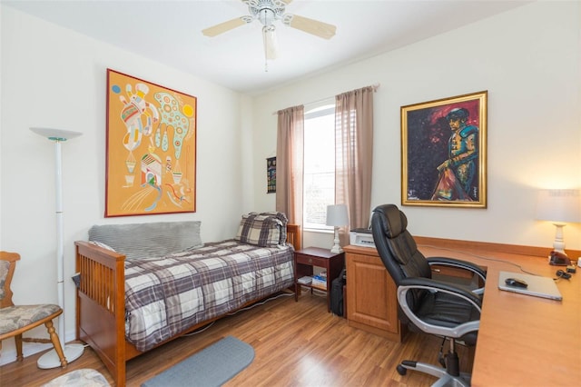 bedroom with light wood-type flooring and ceiling fan