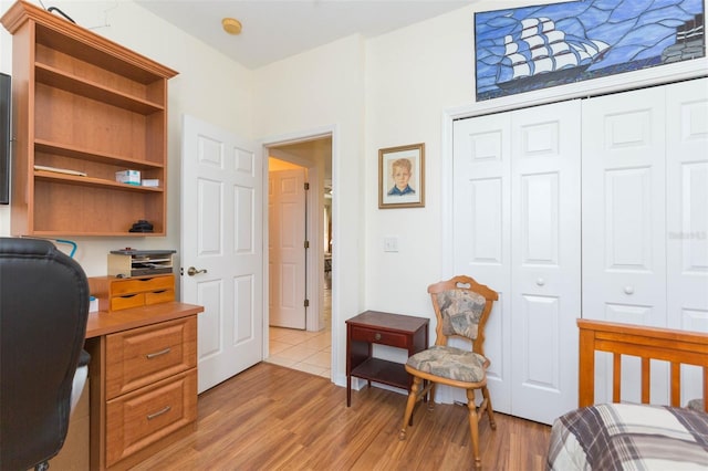 bedroom with a closet and light wood-type flooring