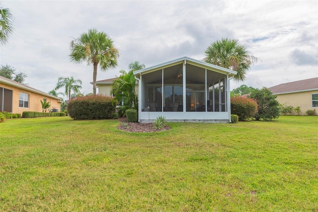 view of yard with a sunroom