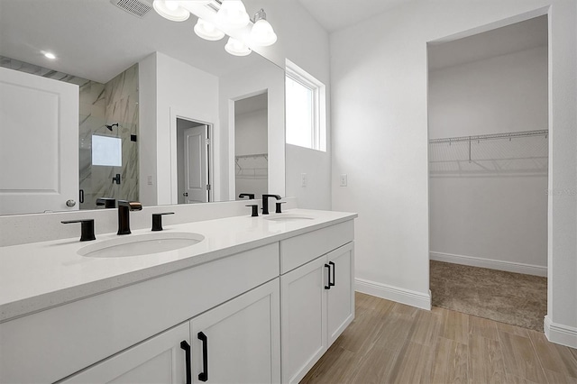 bathroom with vanity and an enclosed shower