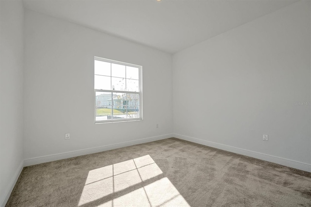 empty room featuring light carpet