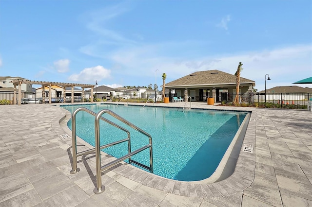 view of swimming pool with a patio