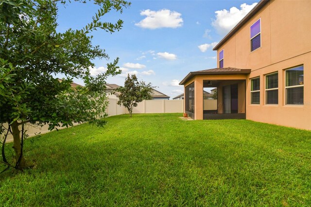 view of yard featuring a sunroom