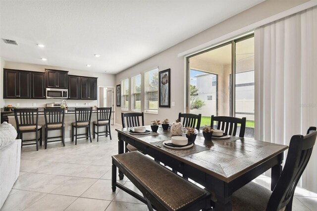 tiled dining area with plenty of natural light