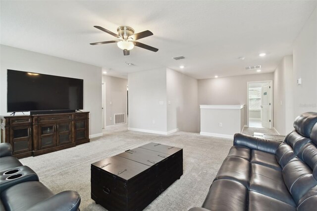 living room featuring ceiling fan and light carpet