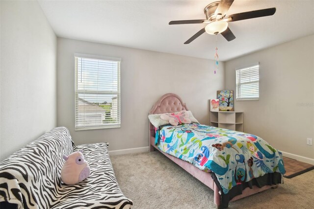 carpeted bedroom featuring ceiling fan