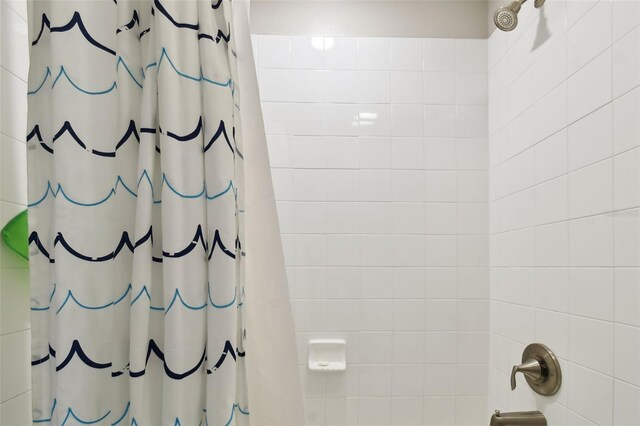 bathroom featuring a shower with curtain