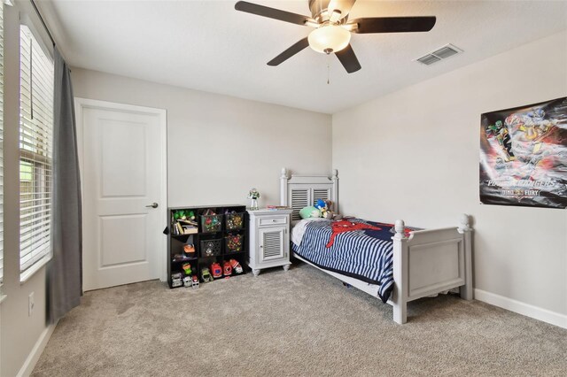 carpeted bedroom with ceiling fan