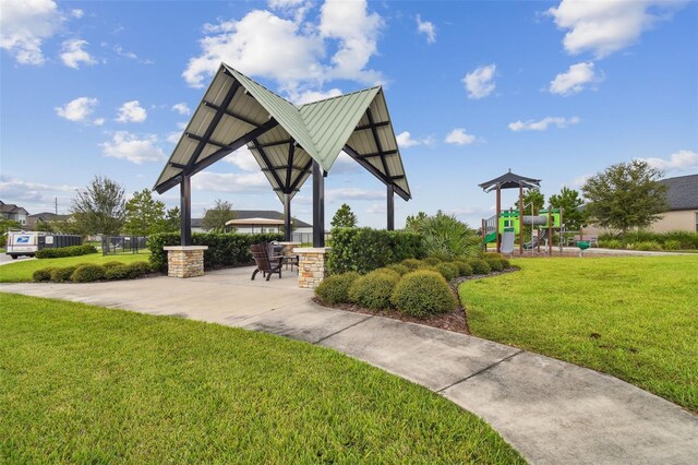 view of home's community featuring a yard, a gazebo, and a playground