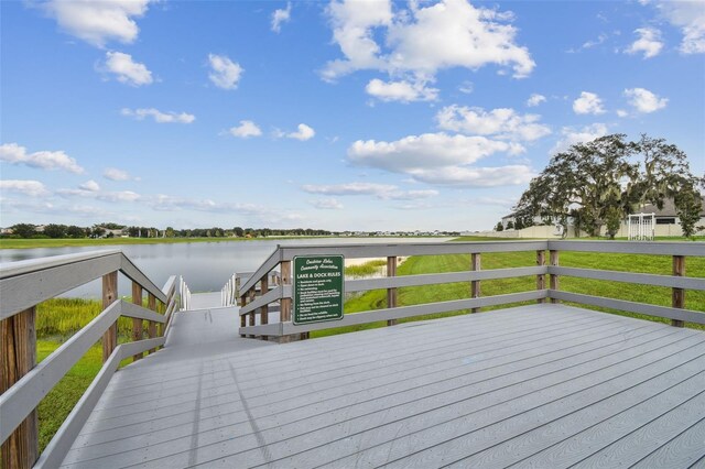 wooden terrace with a water view