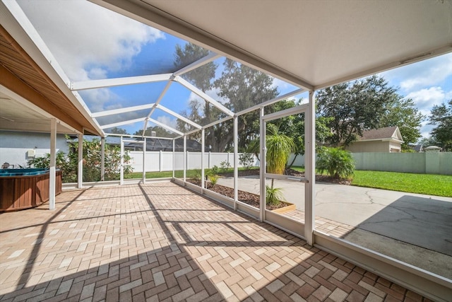 unfurnished sunroom featuring lofted ceiling