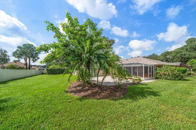 view of yard featuring a lanai