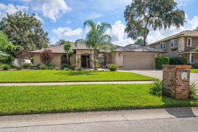 view of front of property featuring a front lawn and a garage