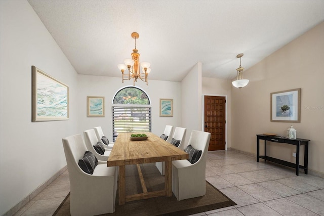 dining area with vaulted ceiling, an inviting chandelier, light tile patterned floors, and a textured ceiling