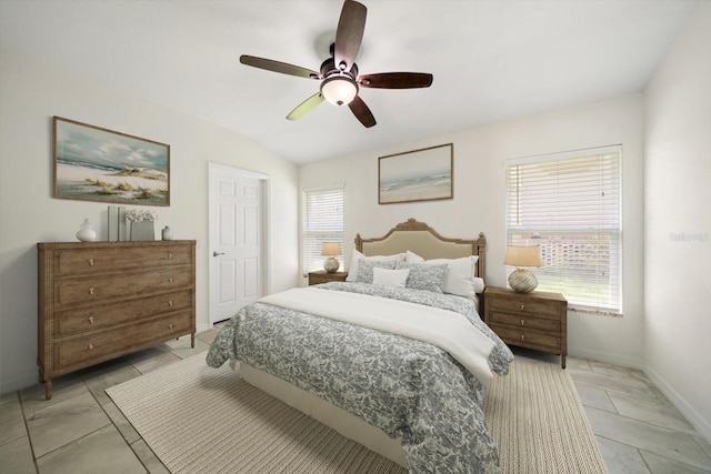 bedroom with ceiling fan and lofted ceiling