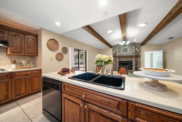 kitchen with a sink, vaulted ceiling with beams, light countertops, backsplash, and black dishwasher