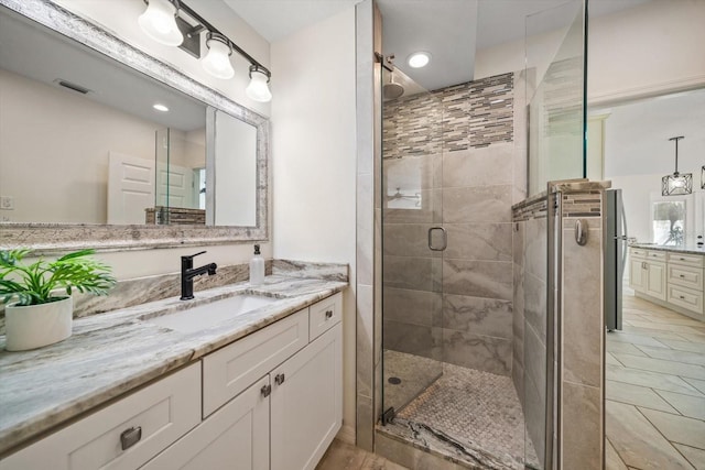 full bath with recessed lighting, a shower stall, visible vents, and vanity