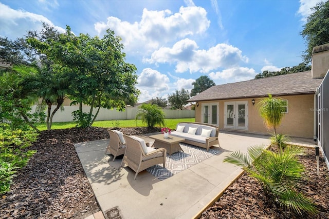 view of patio featuring an outdoor hangout area, french doors, and a fenced backyard