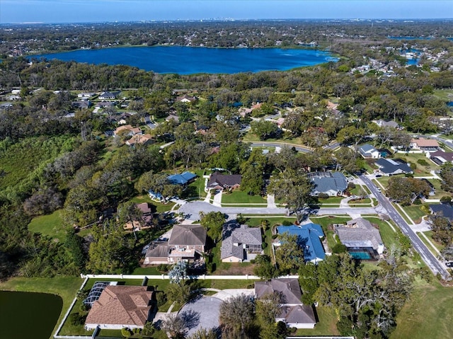 drone / aerial view with a water view and a residential view