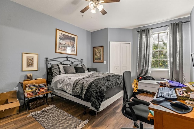 bedroom with wood-type flooring, a closet, and ceiling fan