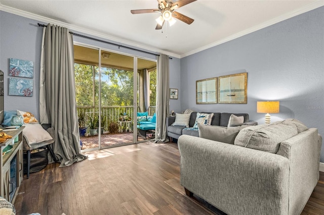 living room featuring ceiling fan, ornamental molding, and dark hardwood / wood-style floors