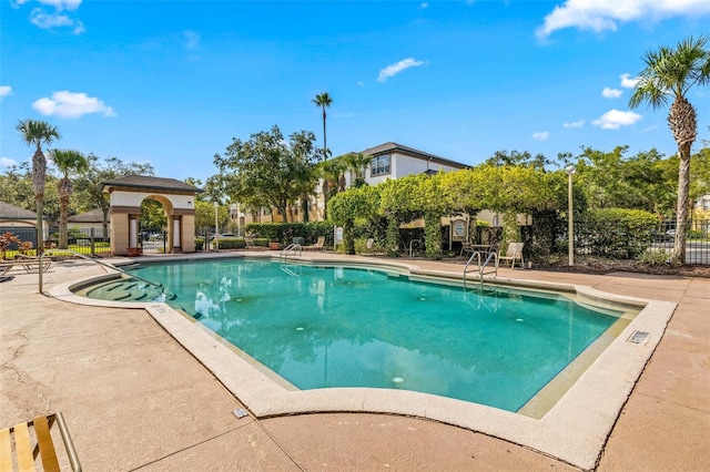 view of swimming pool featuring a patio area