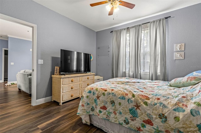 bedroom with dark wood-type flooring and ceiling fan