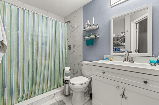 bathroom featuring curtained shower, vanity, and toilet