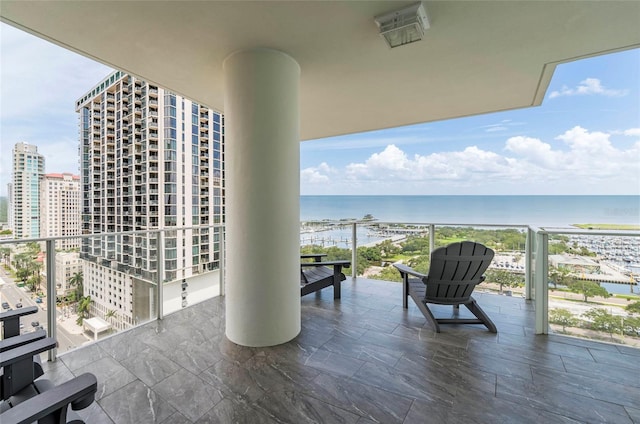 balcony featuring a water view