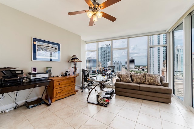 interior space featuring ceiling fan and a wall of windows