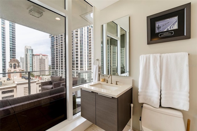 bathroom with vanity and toilet