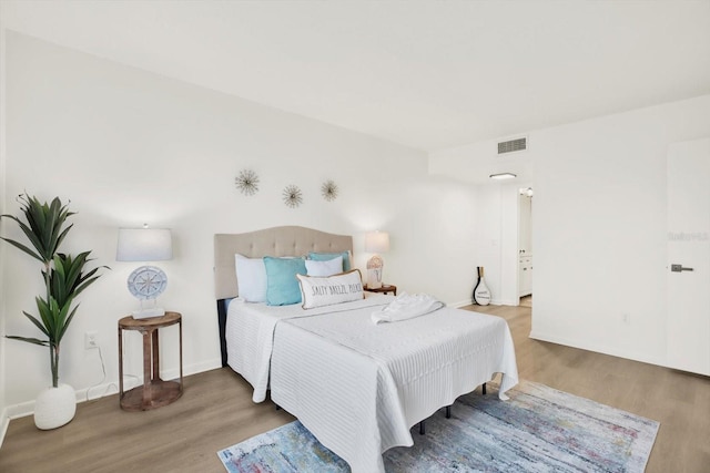 bedroom featuring hardwood / wood-style floors