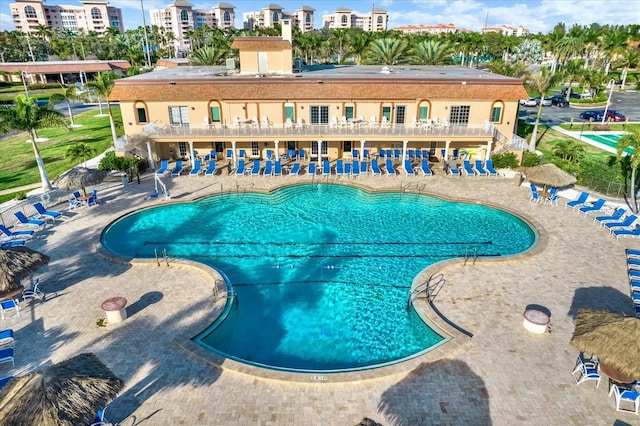 view of swimming pool with a patio