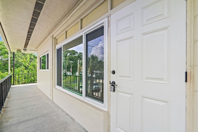 property entrance with covered porch