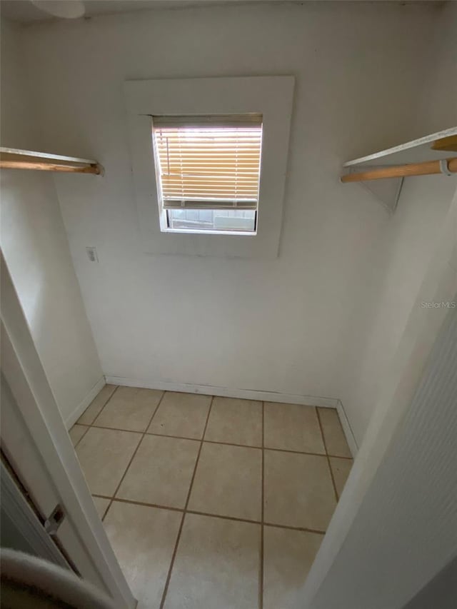 walk in closet featuring light tile patterned floors