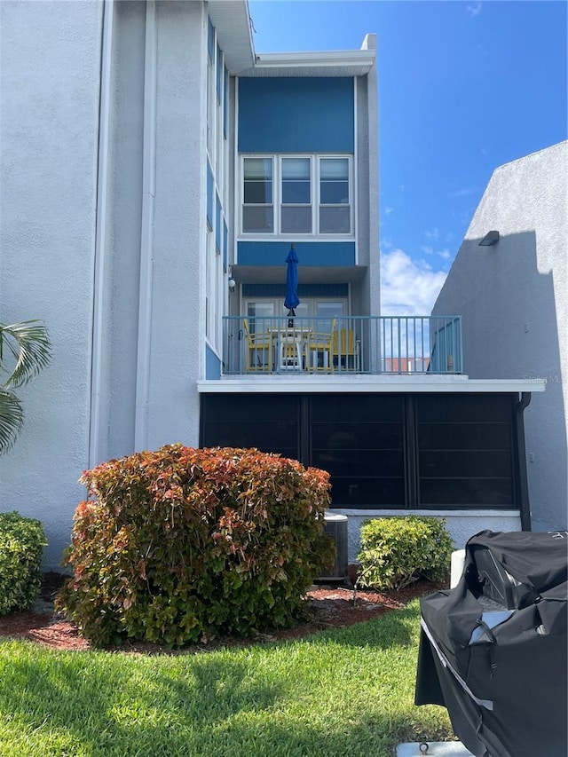 view of home's exterior with a balcony