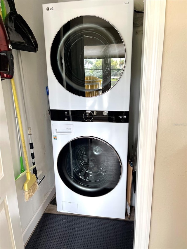 laundry area with stacked washer / dryer