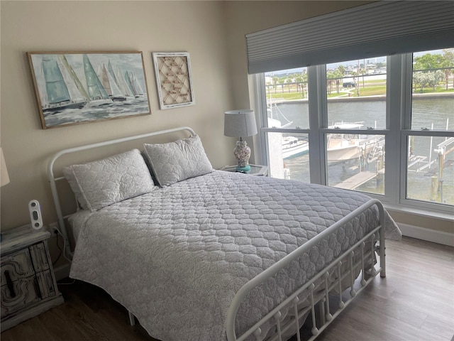 bedroom with wood-type flooring