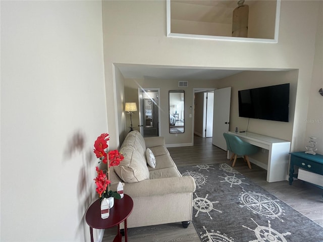 living room with dark wood-type flooring