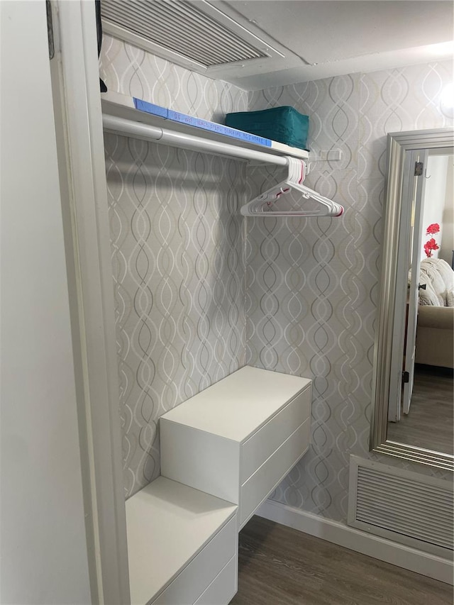 mudroom with dark wood-type flooring