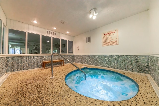 view of pool featuring an indoor hot tub