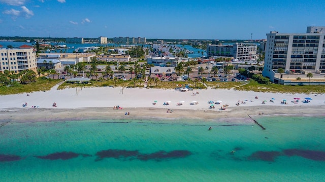 drone / aerial view with a water view and a view of the beach