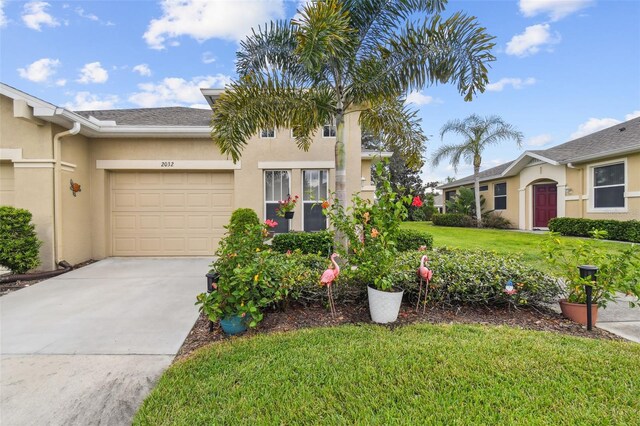 view of front of property with a garage and a front yard