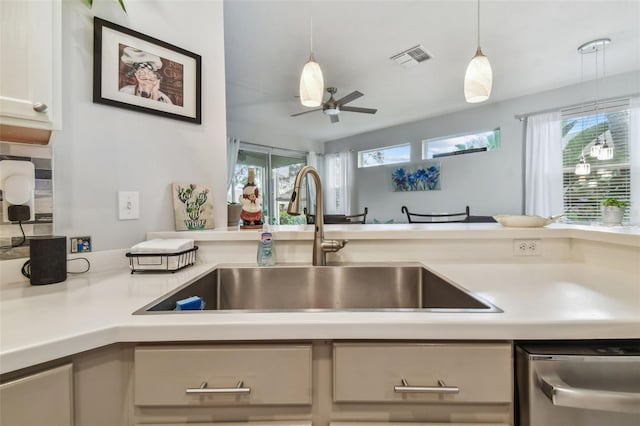 kitchen with pendant lighting, a healthy amount of sunlight, sink, and ceiling fan