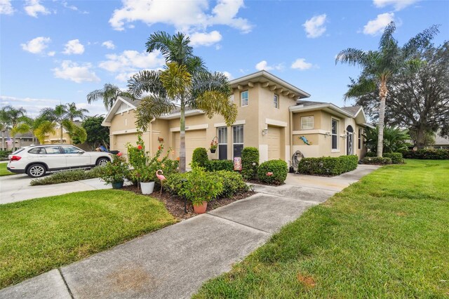 view of front of home featuring a garage and a front lawn