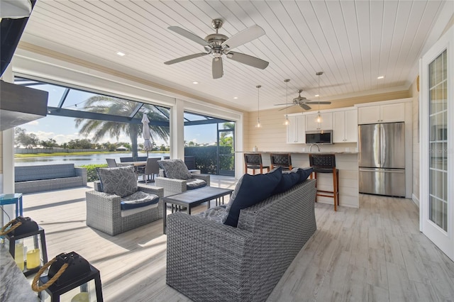 living room with wooden ceiling, ceiling fan, and light hardwood / wood-style flooring