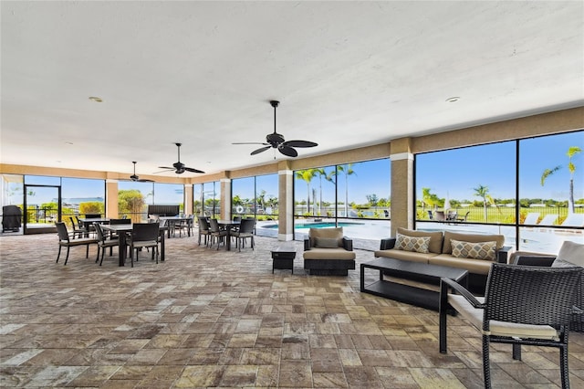 interior space with ceiling fan