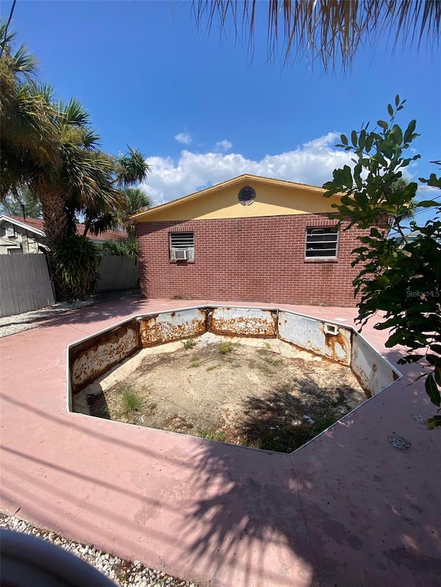 view of side of property featuring a patio