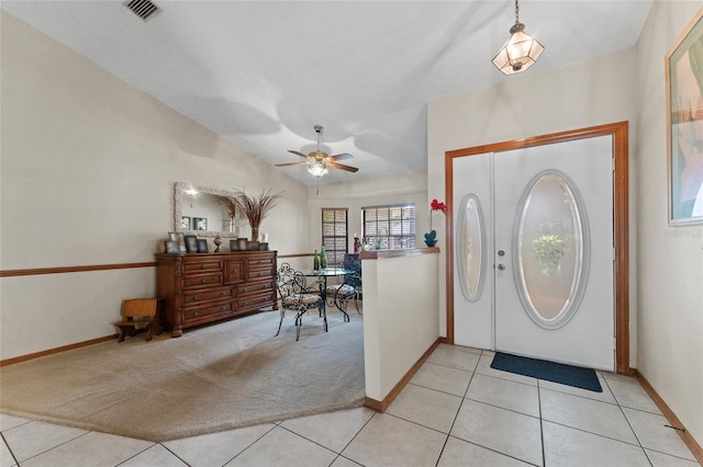 tiled entrance foyer with ceiling fan