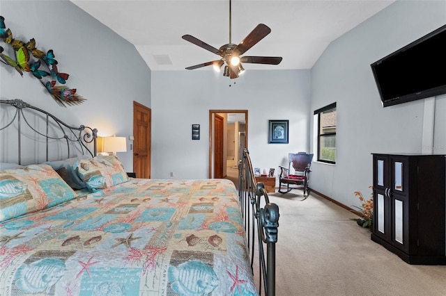 carpeted bedroom featuring lofted ceiling and ceiling fan